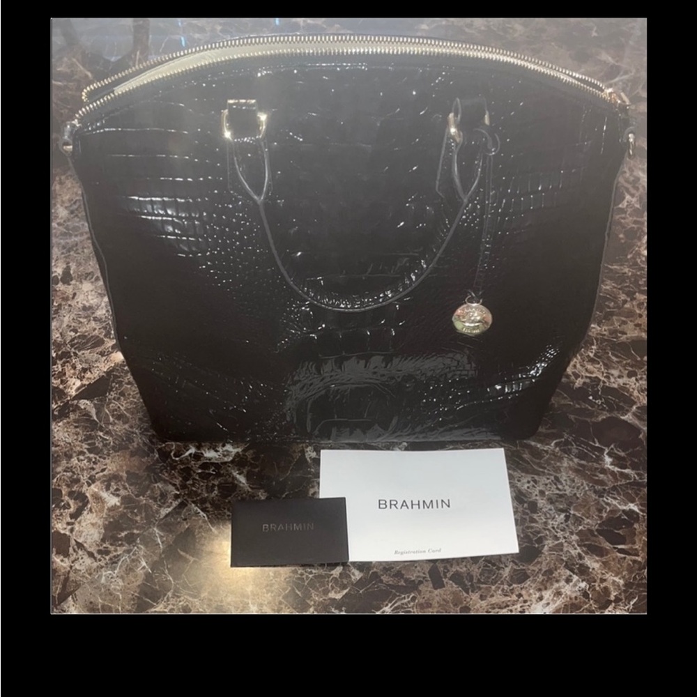 Brahmin “Duxbury” tote 

DIMENSIONS
12.8" W X 9.75" H X 5" D